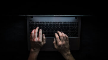 Man looks at OnlyFans on Computer